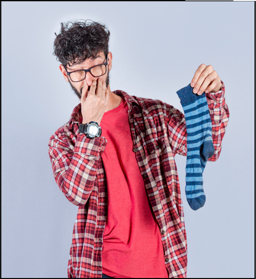 Image of a man holding a stinky sock for a Gruesome Body Facts themed handwriting lesson - classroom resource preview
